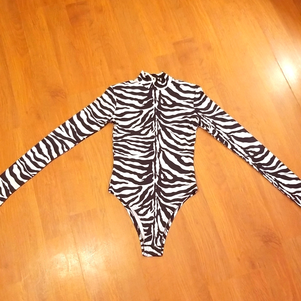 Zebra turtleneck bodysuit with thumb holes in sleeves